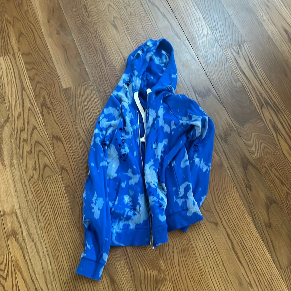 KJ blue hoodie holes are supposed to be there.